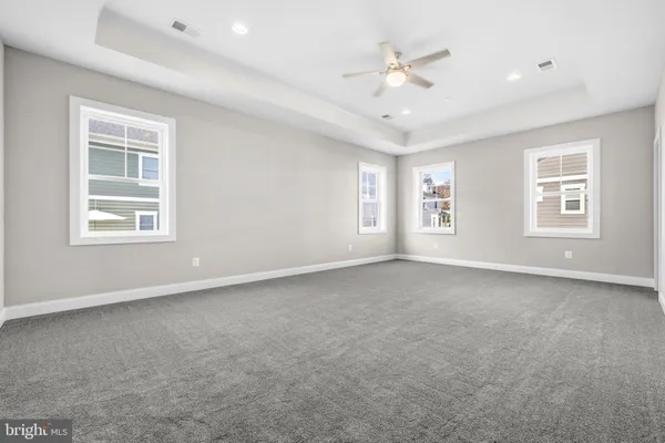a view of an empty room with windows