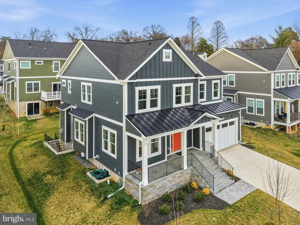 an aerial view of a house with a big yard