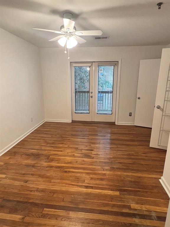 323 8th Street Northeast, Unit 6 Atlanta, GA 30309 - Photo 11 of 15 a view of an empty room with window and wooden floor