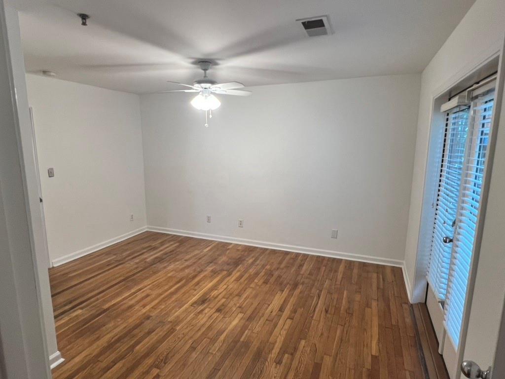 323 8th Street Northeast, Unit 6 Atlanta, GA 30309 - Photo 14 of 15 wooden floor in an empty room with a window