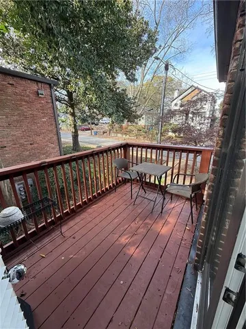 a balcony with wooden floor