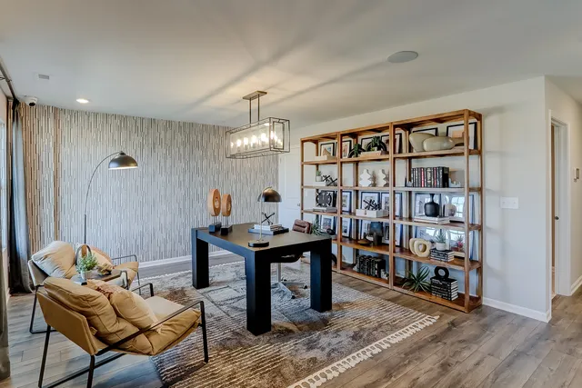 a view of a workspace with furniture