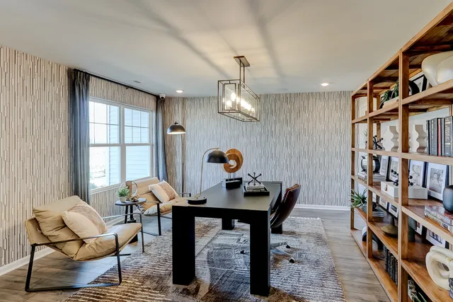 a living room with furniture and a bookshelf