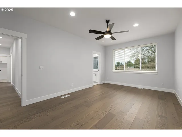a bathroom with a sink a large mirror and a bathtub