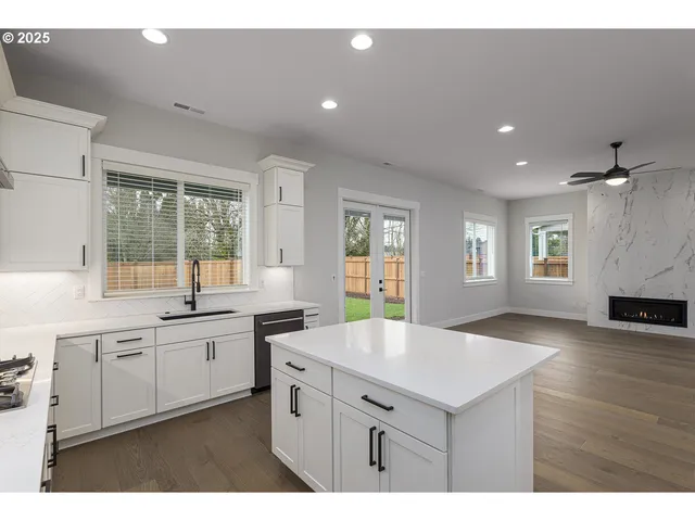 a kitchen with sink and window