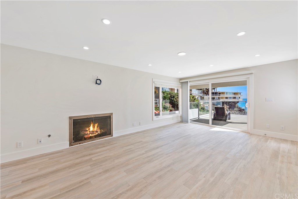 827 Cliff Drive Laguna Beach, CA 92651 - Photo 6 of 19 a view of a livingroom with a fireplace and a window