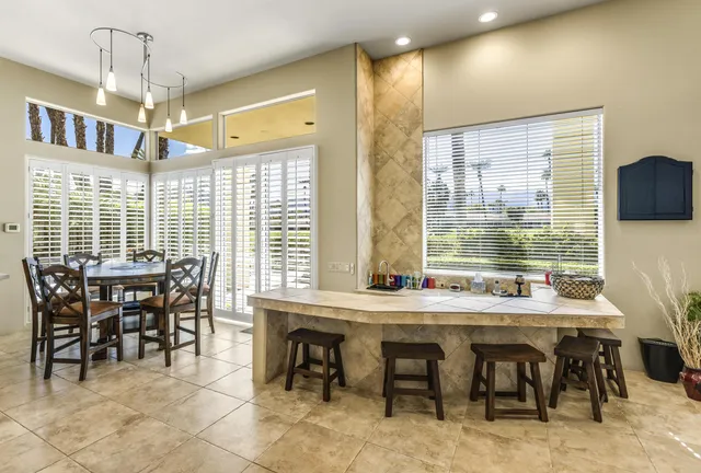 a view of a dining room with furniture window and outside view