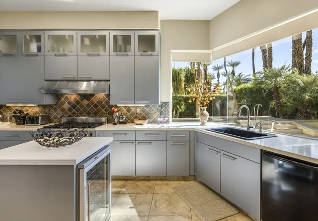 a kitchen with a sink and cabinets