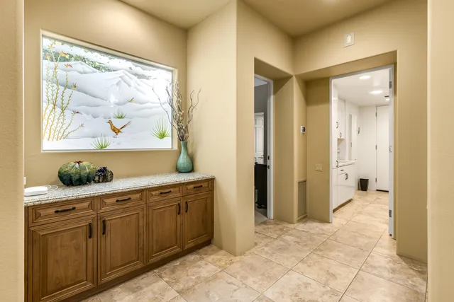 a view of a bathroom with a sink and glass door
