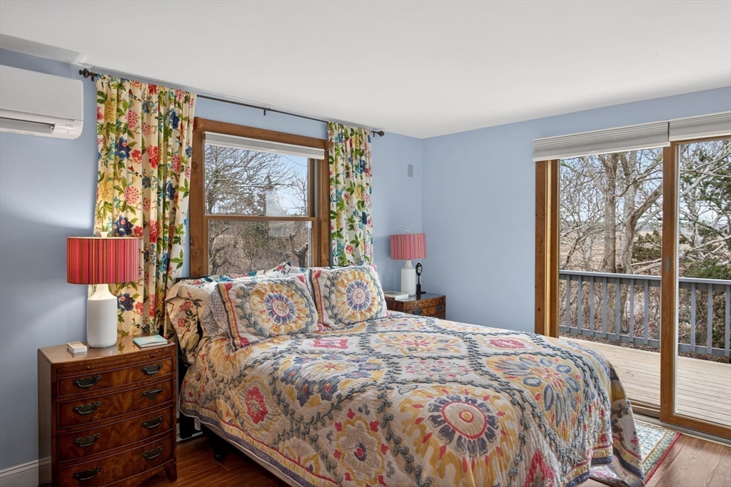 655 Herring Brook Road Eastham, MA 02642 - Photo 14 of 40 a bedroom with a bed and a window