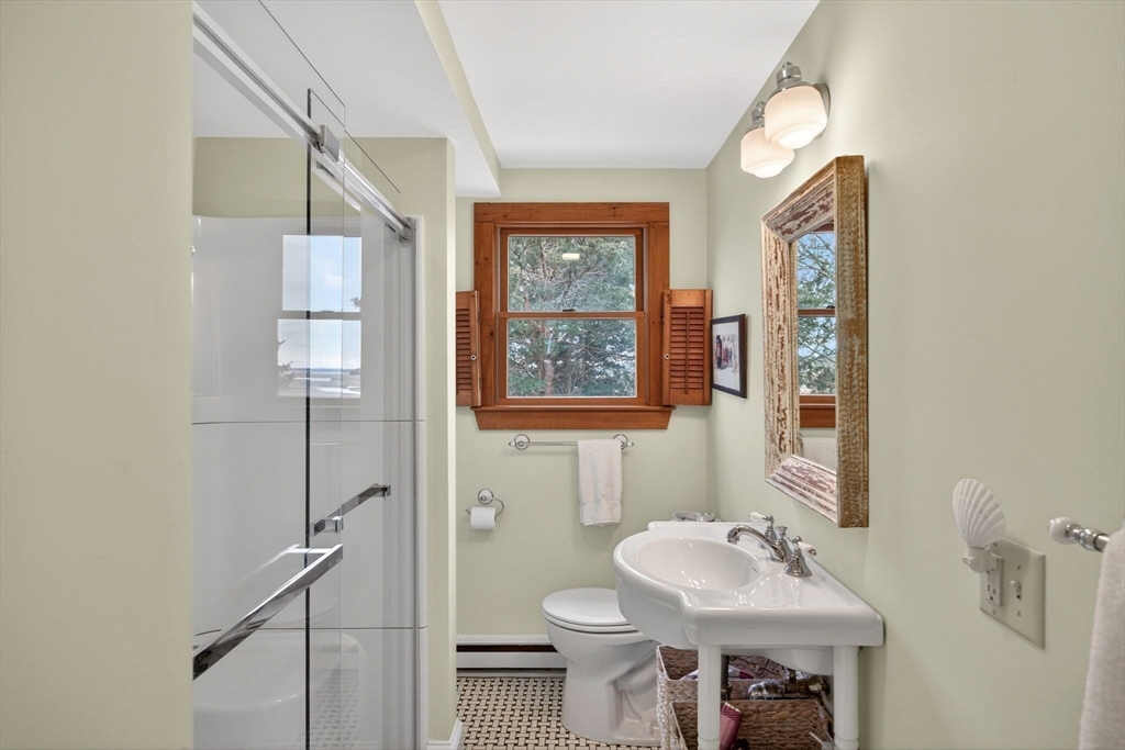 655 Herring Brook Road Eastham, MA 02642 - Photo 15 of 40 a bathroom with a sink and a mirror