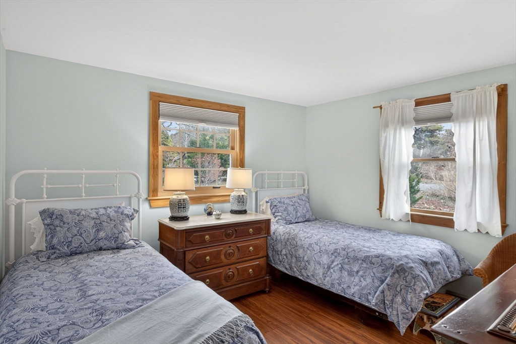 655 Herring Brook Road Eastham, MA 02642 - Photo 16 of 40 a bedroom with a large bed and a window