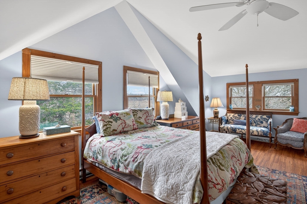655 Herring Brook Road Eastham, MA 02642 - Photo 20 of 40 a bedroom with a bed couch and a large window
