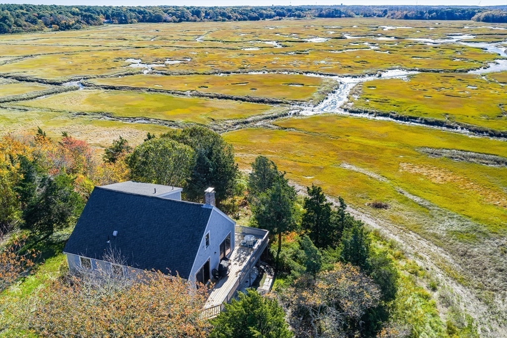 655 Herring Brook Road Eastham, MA 02642 - Photo 2 of 40 a view of an ocean and beach