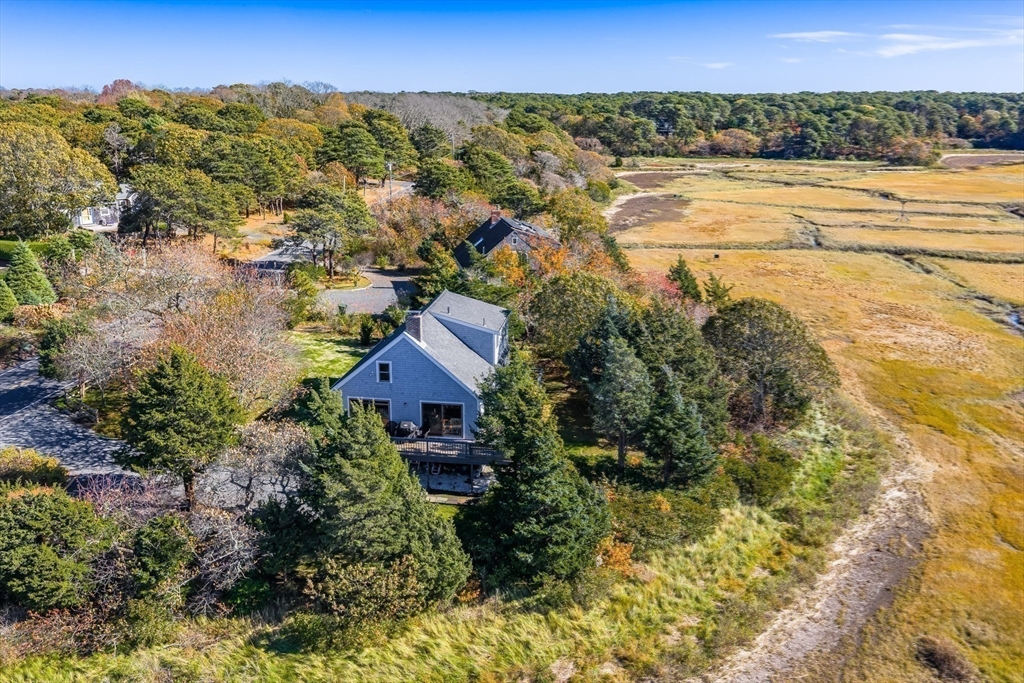 655 Herring Brook Road Eastham, MA 02642 - Photo 24 of 40 an aerial view of residential houses with outdoor space and trees