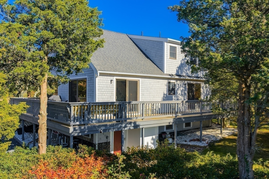 655 Herring Brook Road Eastham, MA 02642 - Photo 27 of 40 a front view of a house with a yard