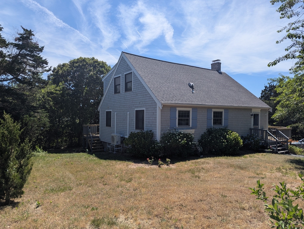 655 Herring Brook Road Eastham, MA 02642 - Photo 37 of 40 a front view of a house with a yard