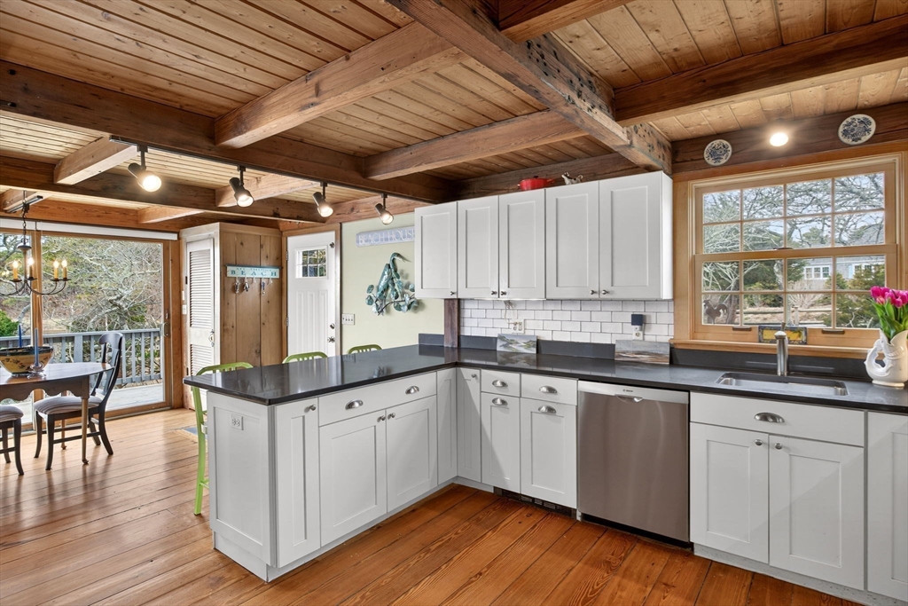 655 Herring Brook Road Eastham, MA 02642 - Photo 5 of 40 a kitchen with sink and cabinets
