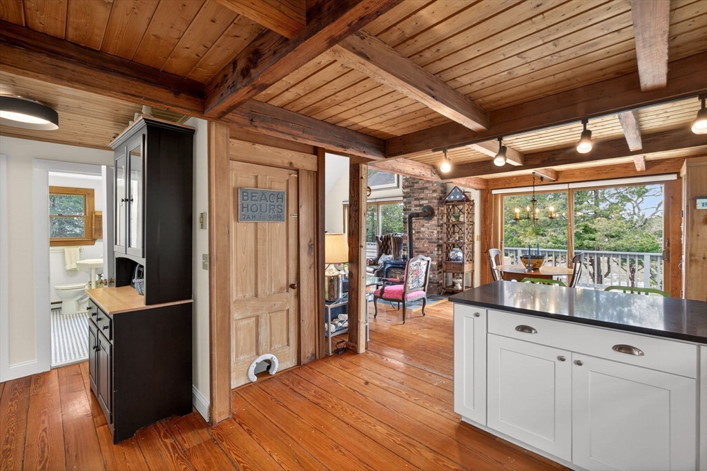 655 Herring Brook Road Eastham, MA 02642 - Photo 6 of 40 a view of a room with wooden floor and furniture