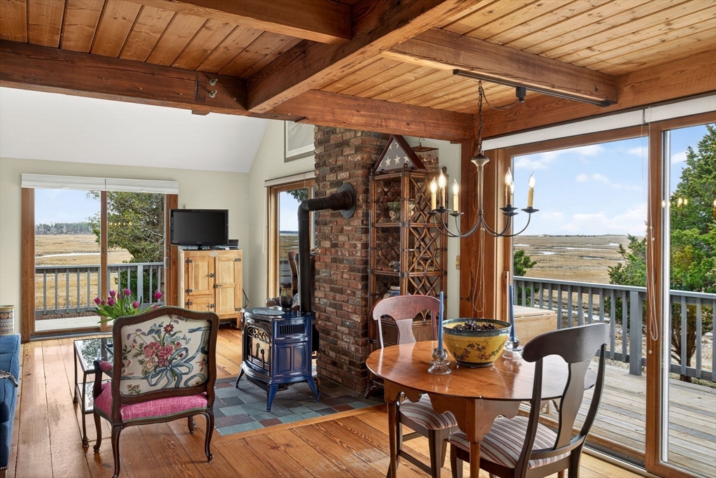 655 Herring Brook Road Eastham, MA 02642 - Photo 8 of 40 a view of a dining room with furniture window and outside view