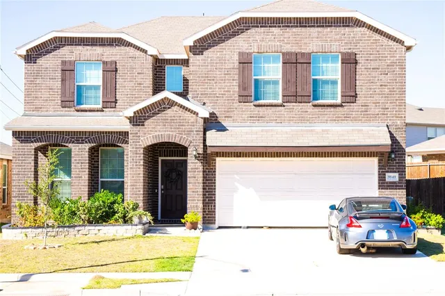 a car parked in front of a house
