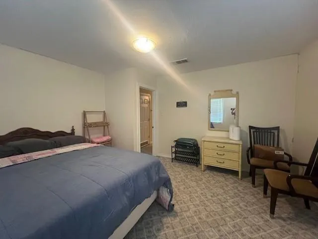 a bedroom with a bed and furniture