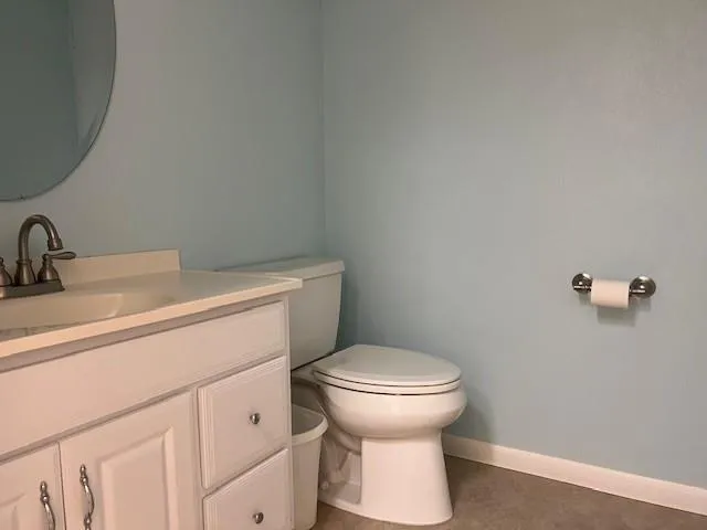 a bathroom with a toilet and a sink