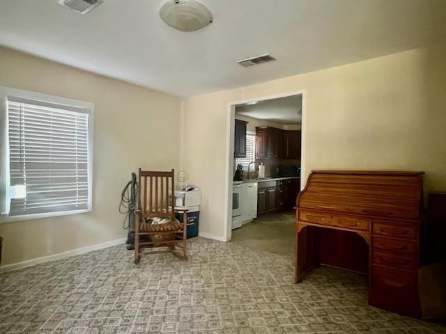 218 Wight Street Roxton, TX 75477 - Photo 2 of 18 a room with a chair and piano table