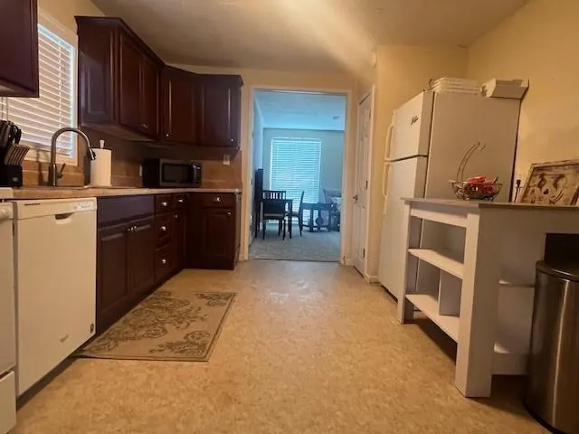 a kitchen with a cabinets and appliances