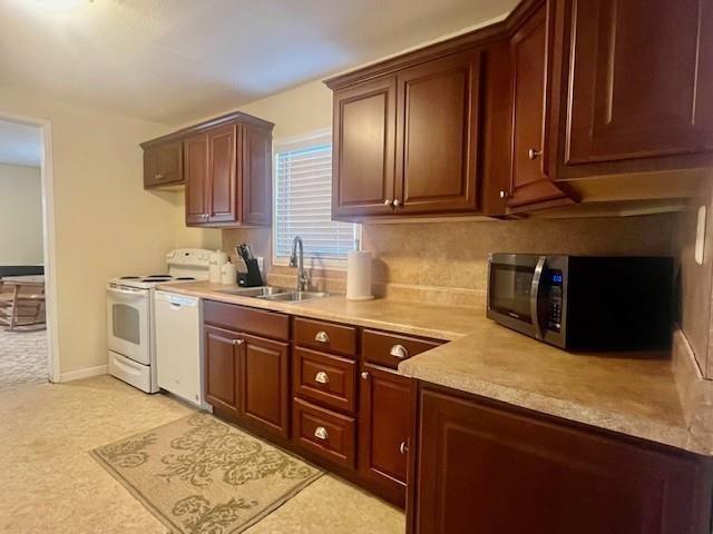 218 Wight Street Roxton, TX 75477 - Photo 7 of 18 a kitchen with stainless steel appliances granite countertop a sink stove and microwave