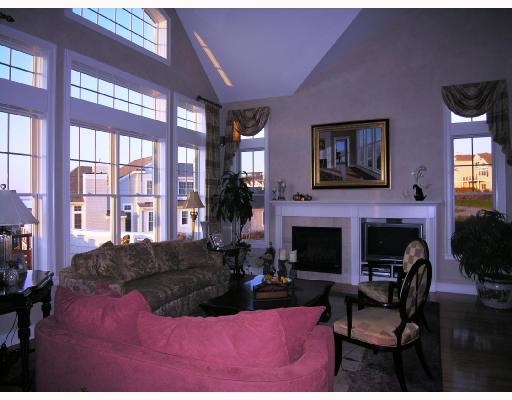 323 Village Road, Unit 32 Tiverton, RI 02878 - Photo 2 of 8 Living Room. Spacious open Living Rm with lots of light. Glass has all been tinted for sun protection.