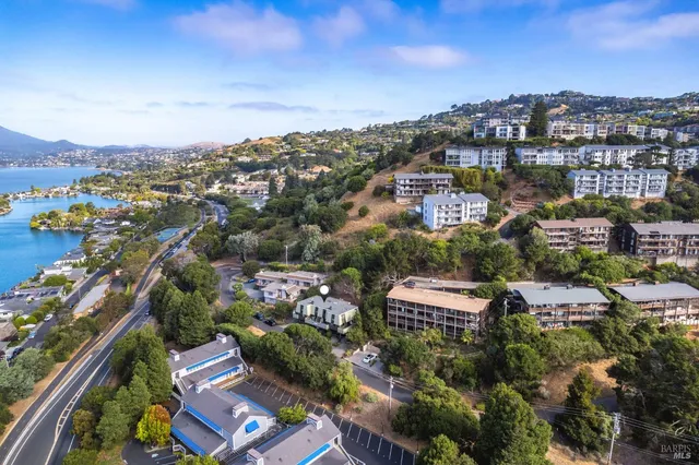 an aerial view of city and lake