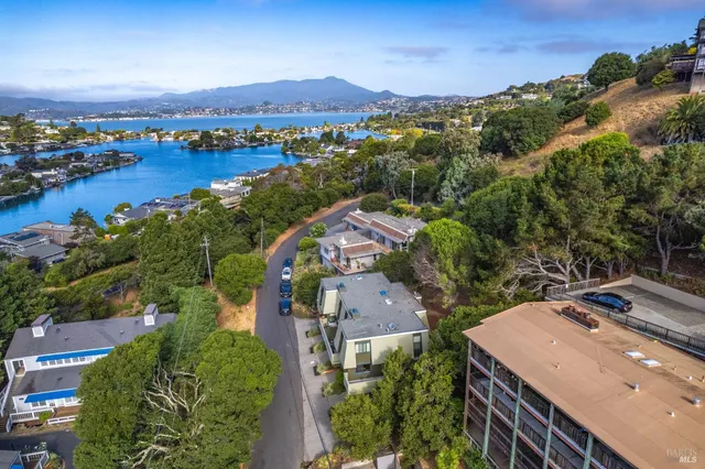 an aerial view of residential houses and outdoor space
