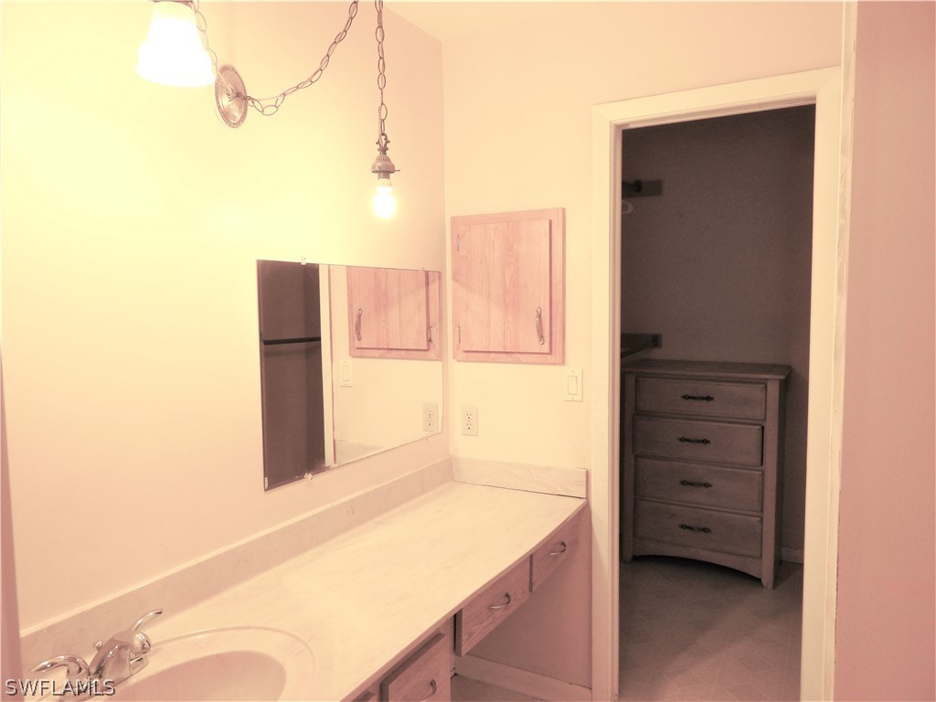 5936 Tarpon Road Bokeelia, FL 33922 - Photo 7 of 17 hallway with cabinet