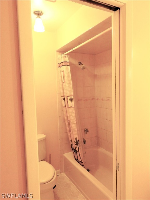 5936 Tarpon Road Bokeelia, FL 33922 - Photo 8 of 17 a bathroom with a bathtub and a toilet