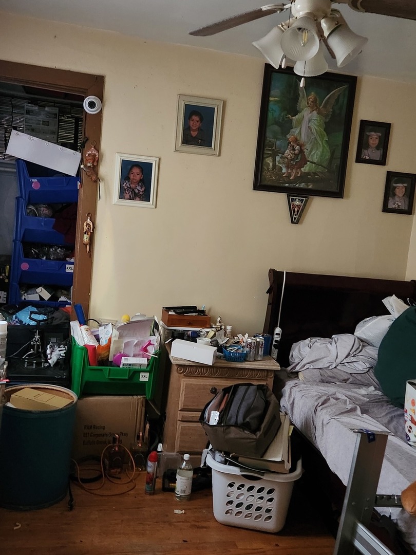 3334 North Harding Avenue Chicago, IL 60618 - Photo 11 of 25 a bedroom with a bed and a window
