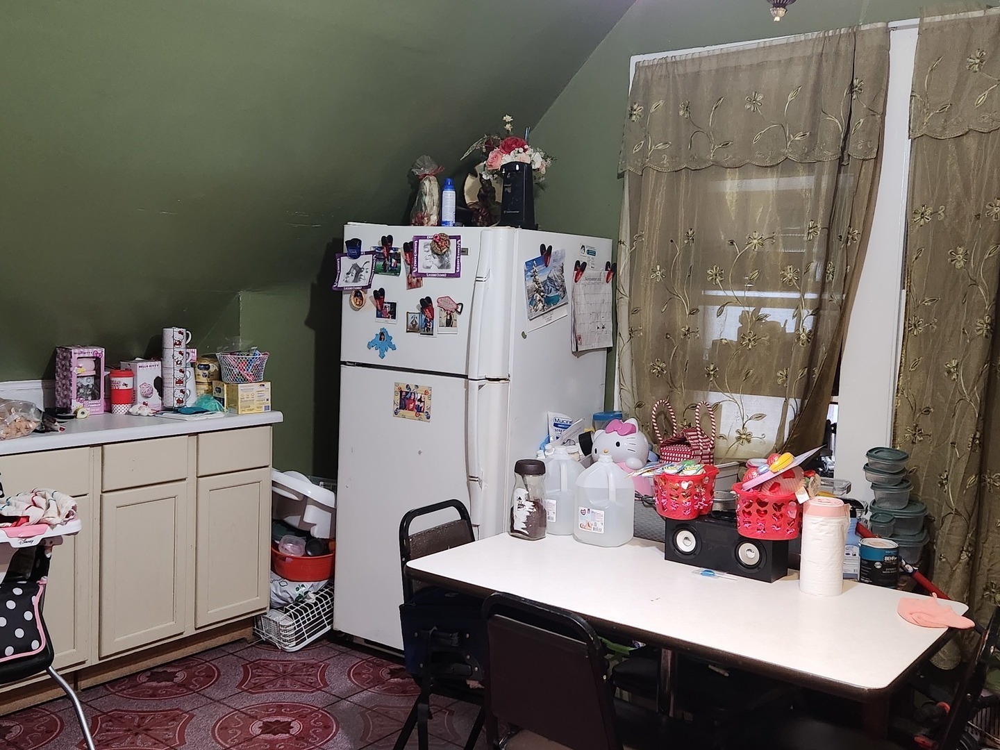 3334 North Harding Avenue Chicago, IL 60618 - Photo 16 of 25 a kitchen with a refrigerator and a table