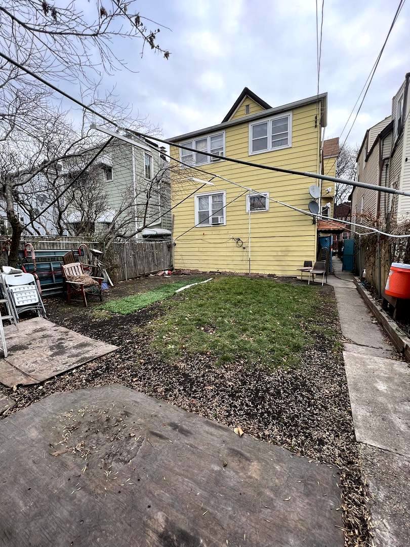 3334 North Harding Avenue Chicago, IL 60618 - Photo 18 of 25 a front view of a house with a yard