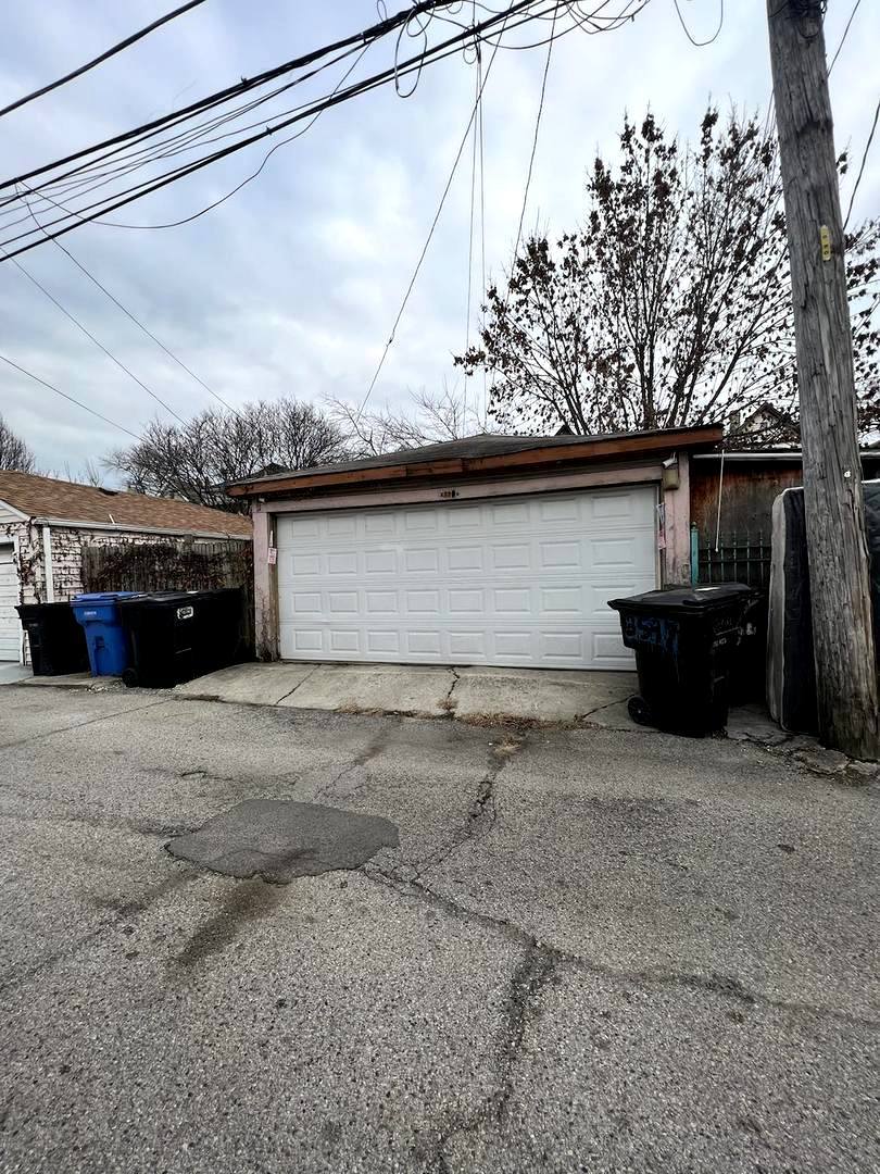 3334 North Harding Avenue Chicago, IL 60618 - Photo 21 of 25 a front view of a house with a yard