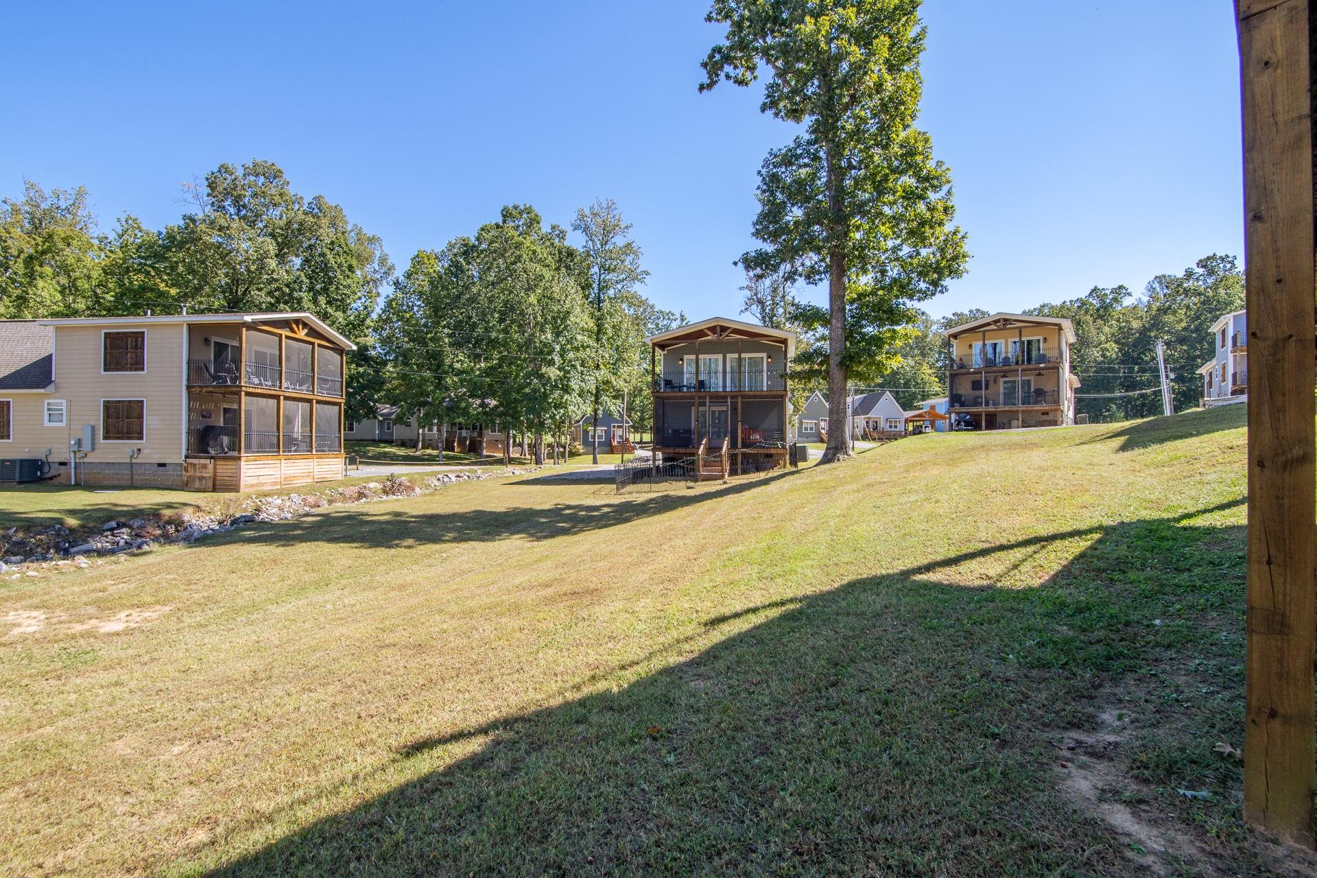 25 Bogey Loop Counce, TN 38326 - Photo 6 of 37 View of grassy yard with a balcony