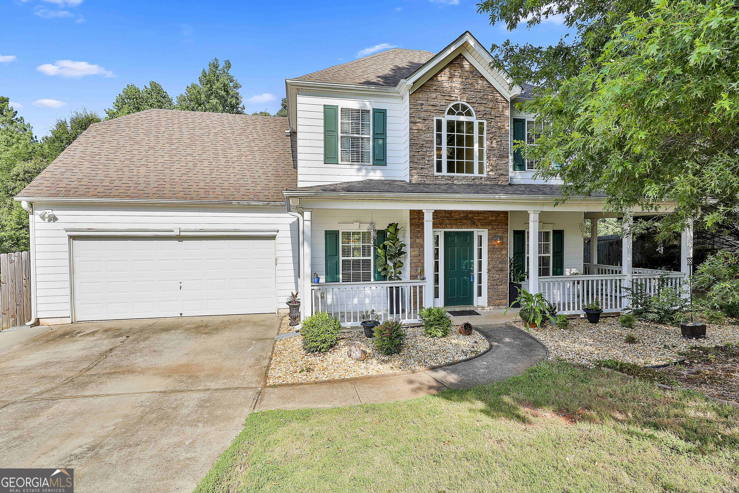 215 Forrest Run Palmetto, GA 30268 - Photo 1 of 1 a front view of a house with a yard and outdoor seating