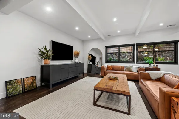 a view of living room with furniture and flat screen tv