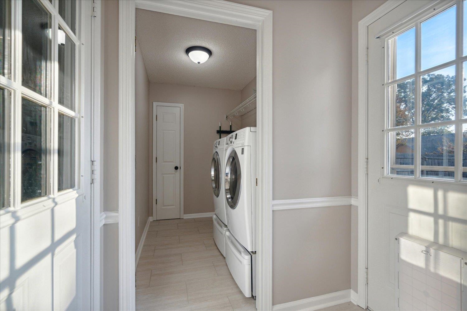 6893 Andrews Road Bartlett, TN 38135 - Photo 24 of 30 Laundry room with a textured ceiling and separate washer and dryer