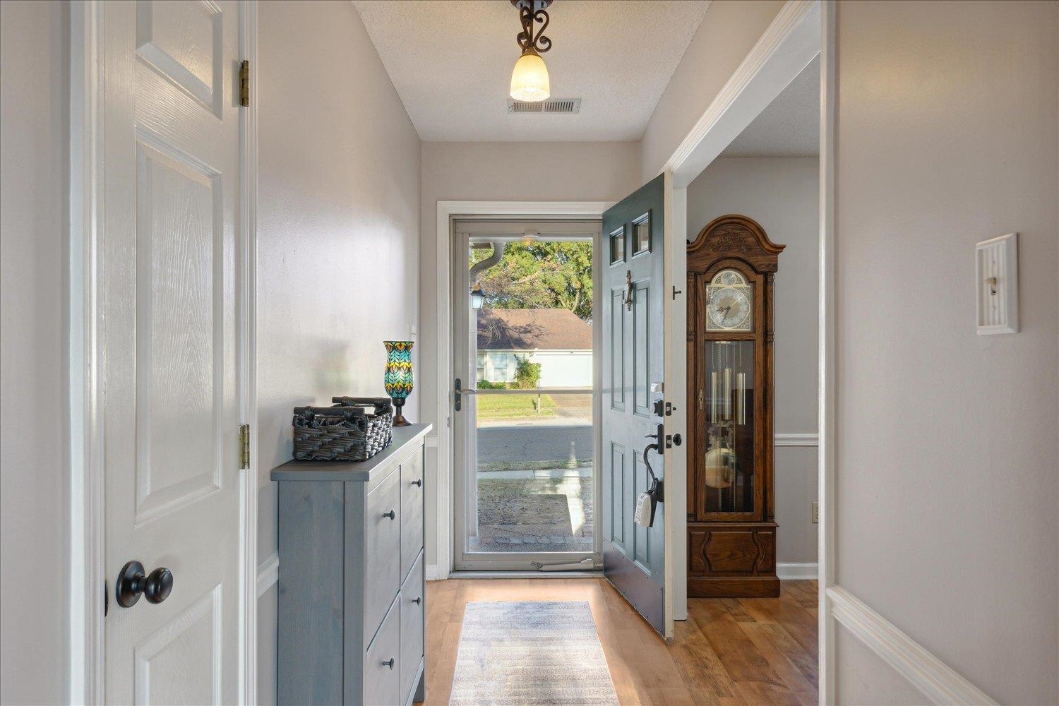 6893 Andrews Road Bartlett, TN 38135 - Photo 7 of 30 Entryway with light hardwood / wood-style flooring and a textured ceiling