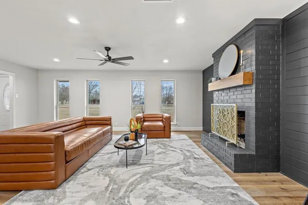 a living room with furniture and a fireplace