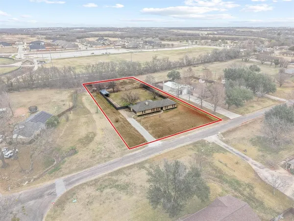 a view of a living room and a floor to ceiling window