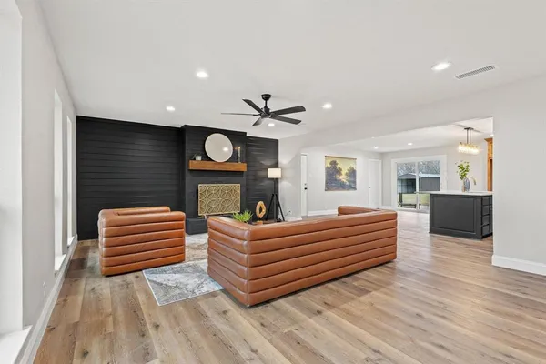 a room with a bed and a television