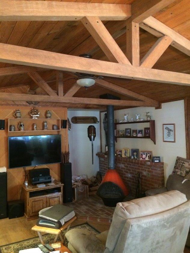 114 Burnham Road Oak View, CA 93022 - Photo 2 of 4 a living room with furniture and a flat screen tv