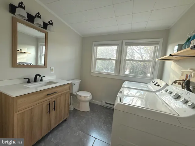 a bathroom with a sink and a window