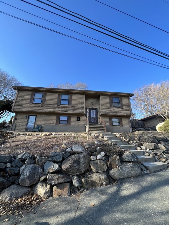 a room with furniture pool table and kitchen view